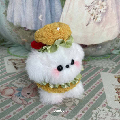 Cosplay Puppy Collection: Fluffy white puppy doll in yellow and green costume with a cute hat, perfect for collectors.