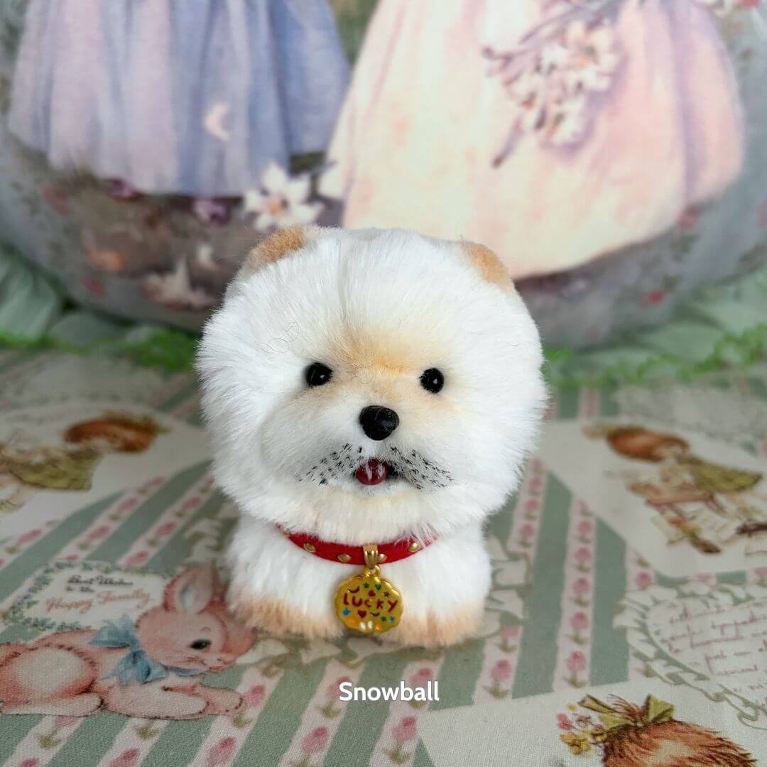 Lifelike Puppy Collection features a fluffy white puppy figurine with soft fur, a red collar, and a lucky charm, perfect for collectors.