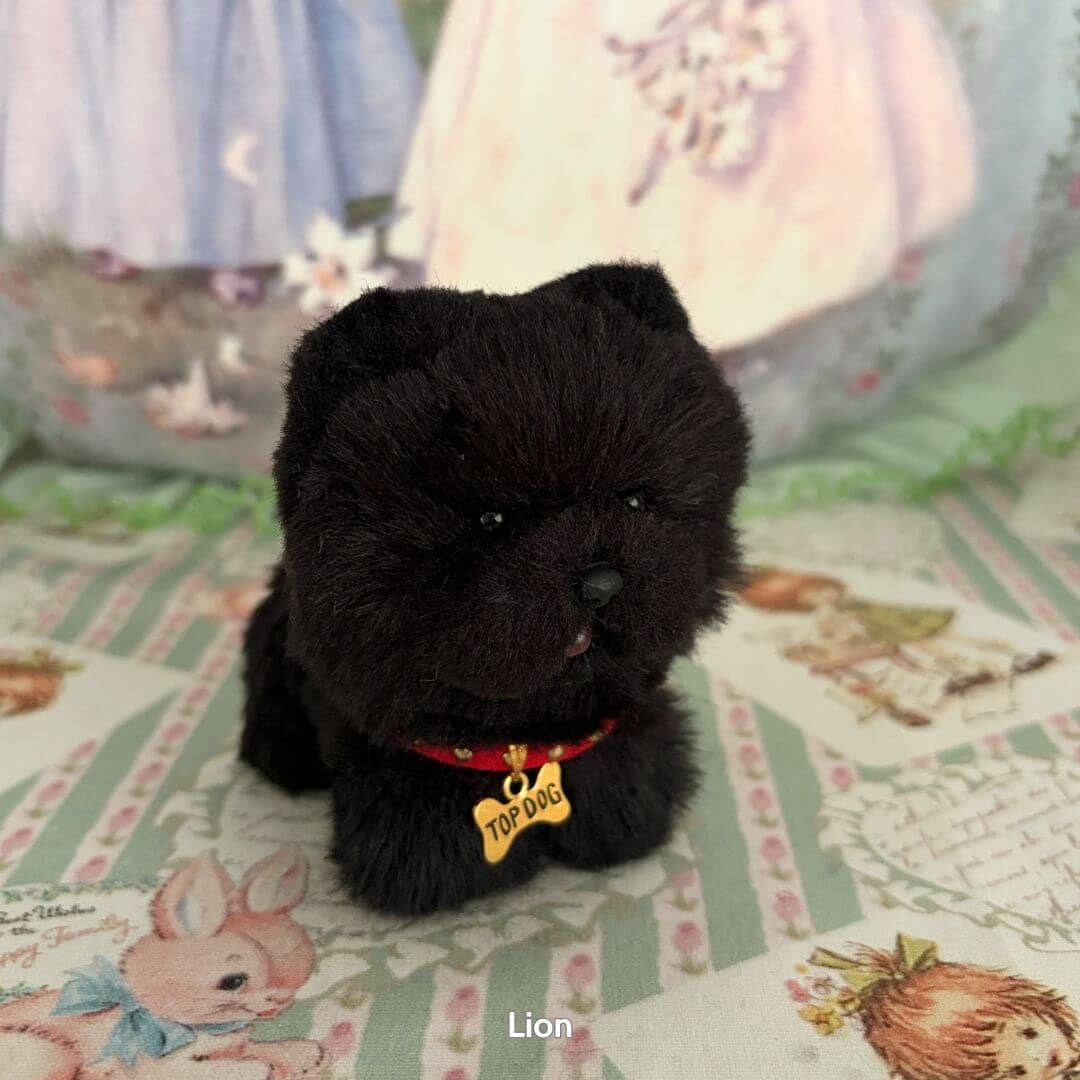 Lifelike Puppy Collection featuring a fluffy black dog figurine with a 'TOP DOG' collar, showcasing realistic details and soft textures.