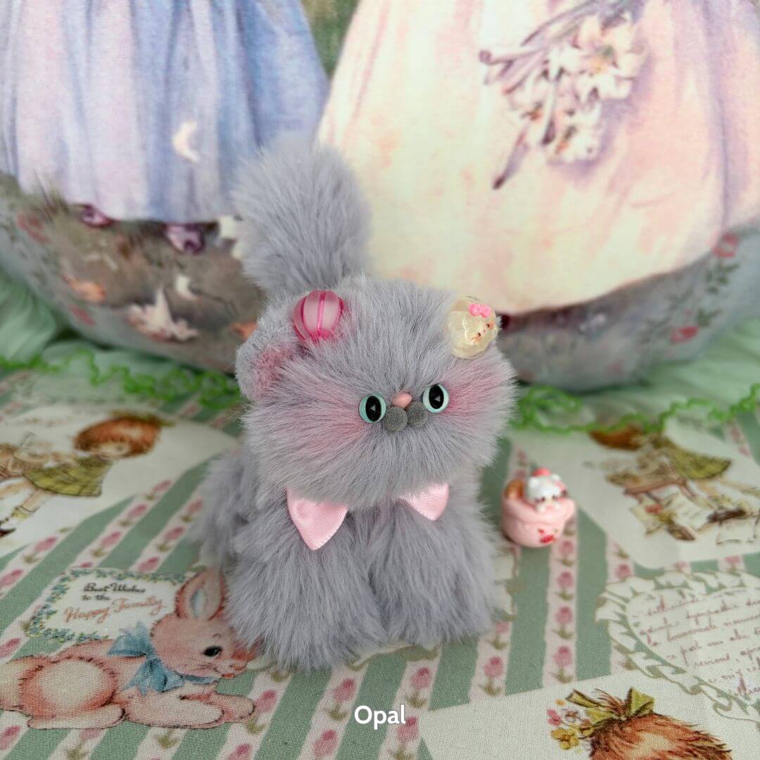 Grey Kitten Collection: cute fluffy grey kitten figurine with pink accessories, including a bow and cupcakes, handmade in UK.