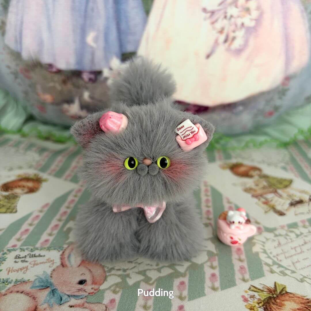 Handmade kitten from the Grey Kitten Collection, fluffy grey fur with pink accessories, cute animal collectible.
