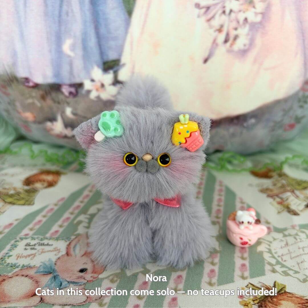 Grey Kitten Collection: Handmade kitten with fluffy grey fur, cute accessories, and adorable pose, perfect for collectors.
