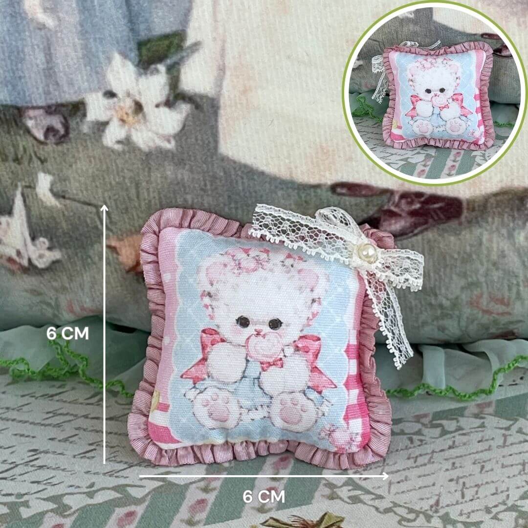 Handmade Tiny Cuddle Critter Cushion with kitten design, hand-stitched bow, 6 cm size, perfect plush toy or decorative desk accessory.