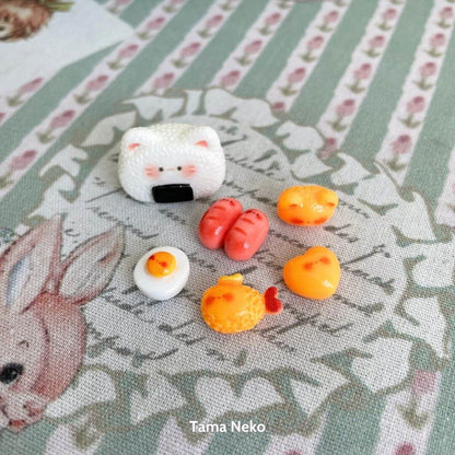 Mini Cat Bento Box featuring a handmade kitten, kawaii cat face, and colorful miniature food items like sushi and eggs.
