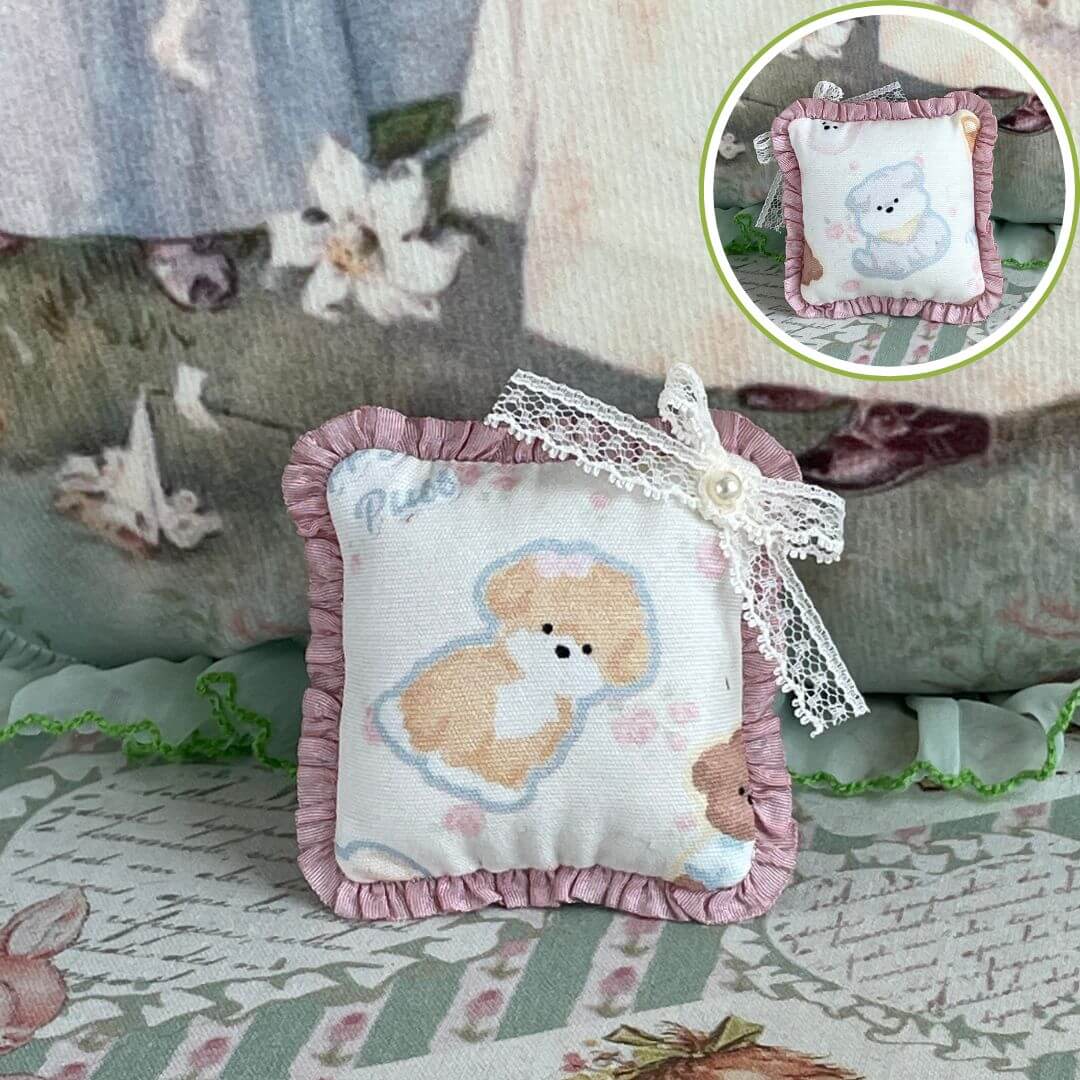 Handmade tiny cuddle critter cushion with puppy design and hand-stitched bow, ideal for dolls or desk decor, 6x6 cm, unique piece.