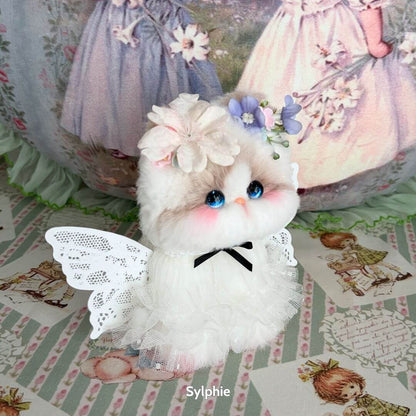 Enchanting fluffy kitten figurine in white dress with wings, adorned with flowers, from the Enchanted Big Paws Collection.