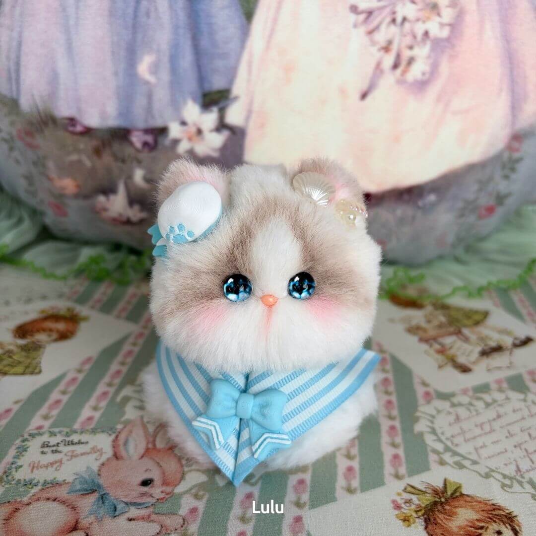 Handmade kitten from the Cosplay Kitten Collection, fluffy cat figurine in blue accessories, kawaii style, adorable decoration.