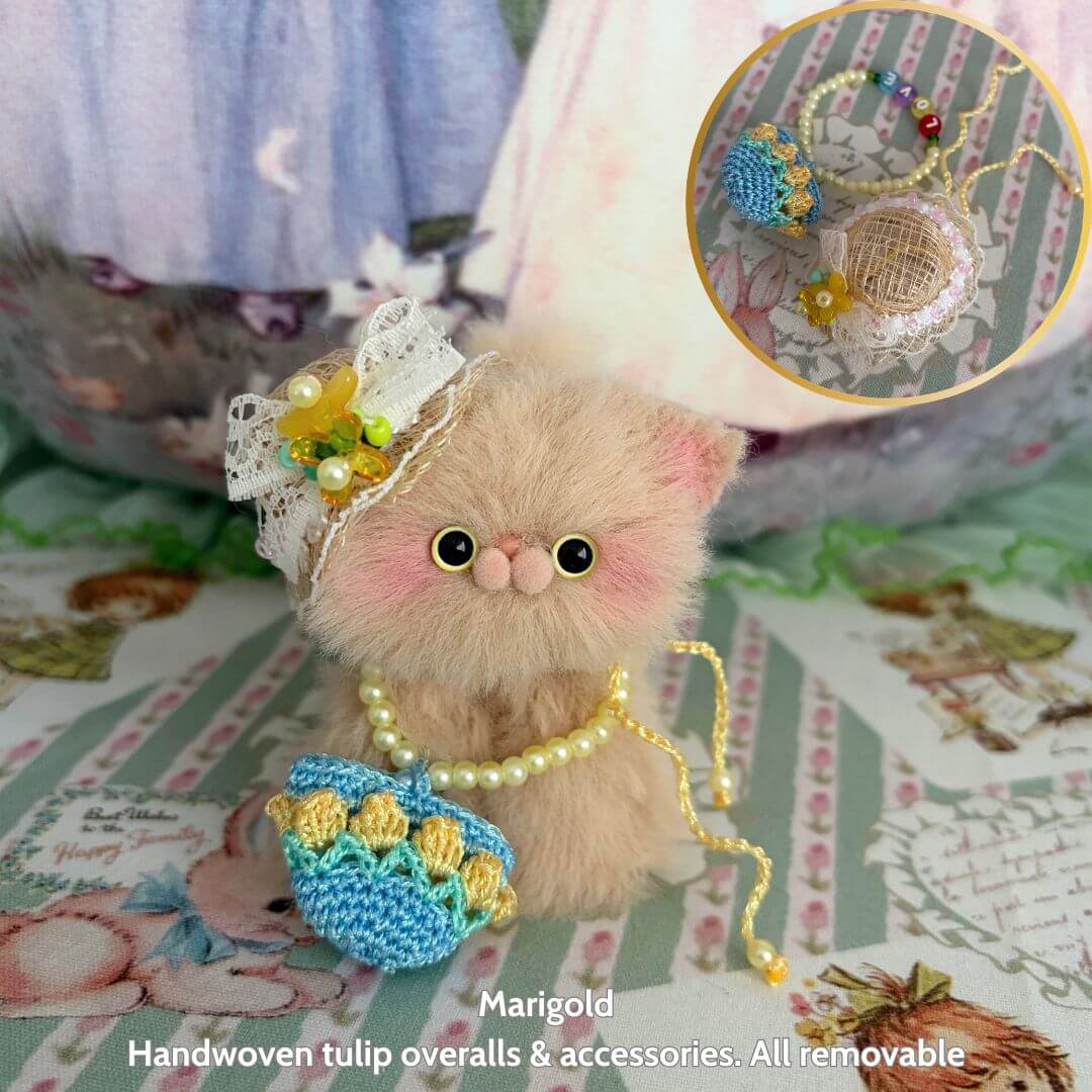 Spring Love Limited Collection handmade kitten with fluffy fur, cute accessories, and tulip overalls, posing adorably.
