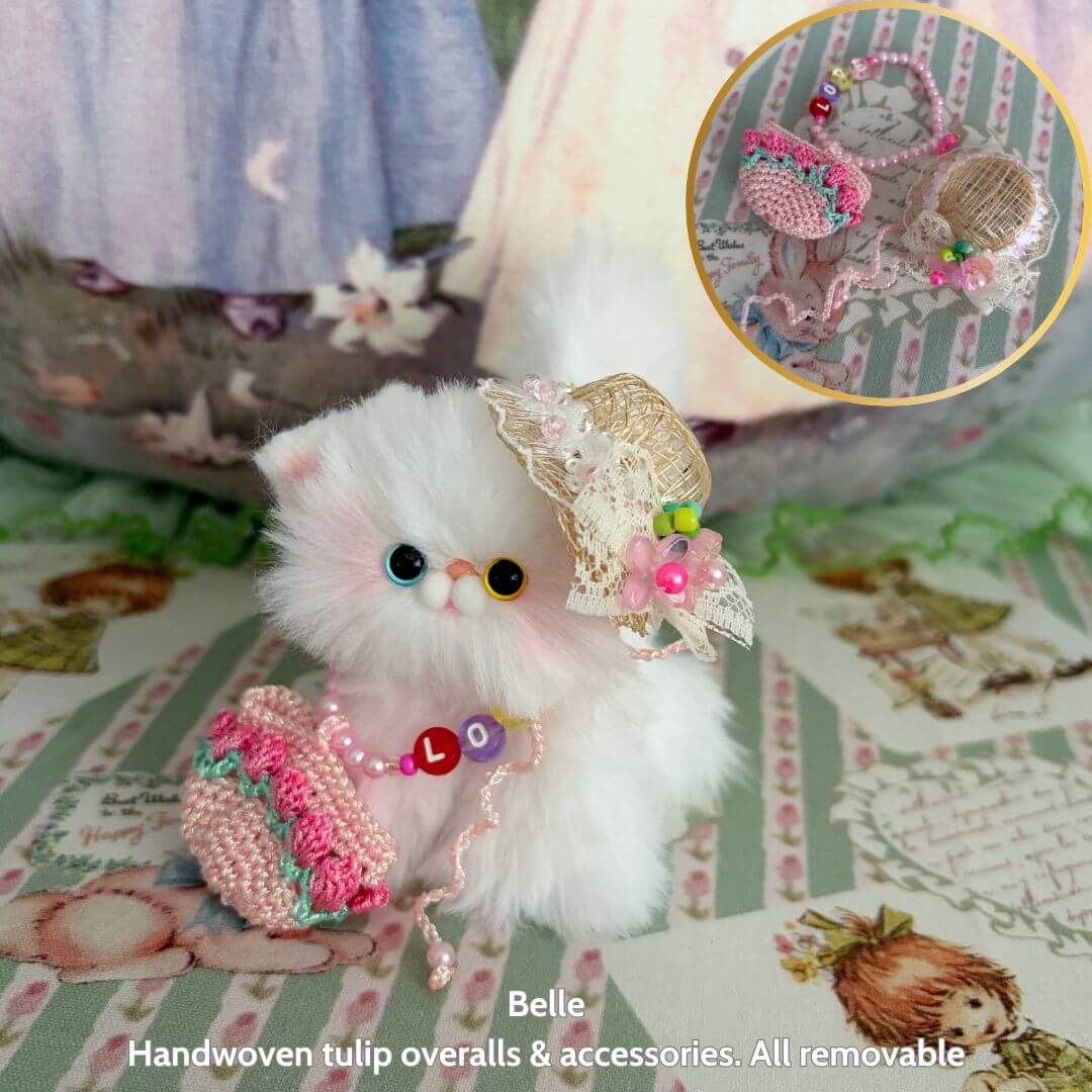 Spring Love Limited Collection: fluffy handmade kitten in tulip overalls, cute accessories, and pastel colors, posing with a basket.