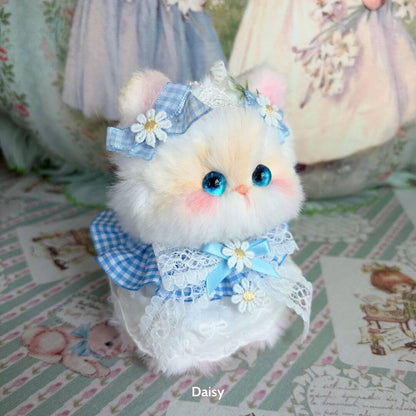 Adorable fluffy kitten figurine from the Enchanted Big Paws Collection, dressed in blue and white lace with flowers, handmade in UK.