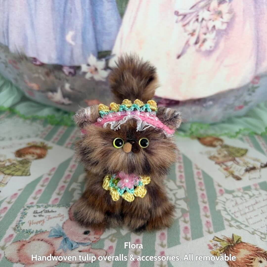 Alt Tag: Spring Love Limited Collection handmade kitten with fluffy fur, wearing colorful tulip overalls and accessories.