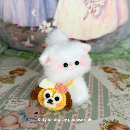 Adorable Snuggle Bits handmade kitten figurine with fluffy white fur and colorful animal purse, perfect for collectors.