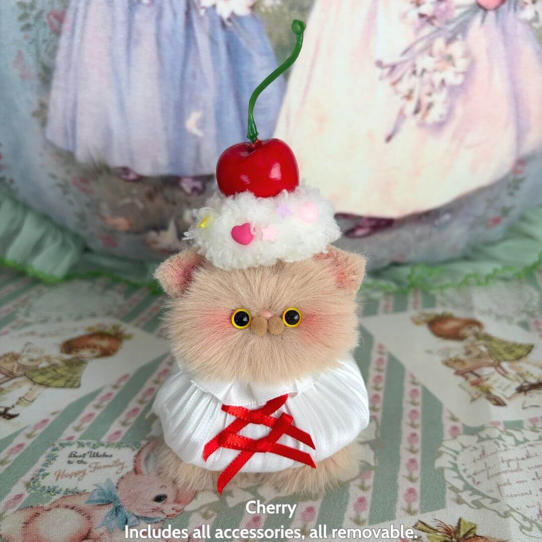 Sweet Treat Kitties handmade kitten, fluffy cat figurine with cherry topping, kawaii style, wearing a cute outfit.