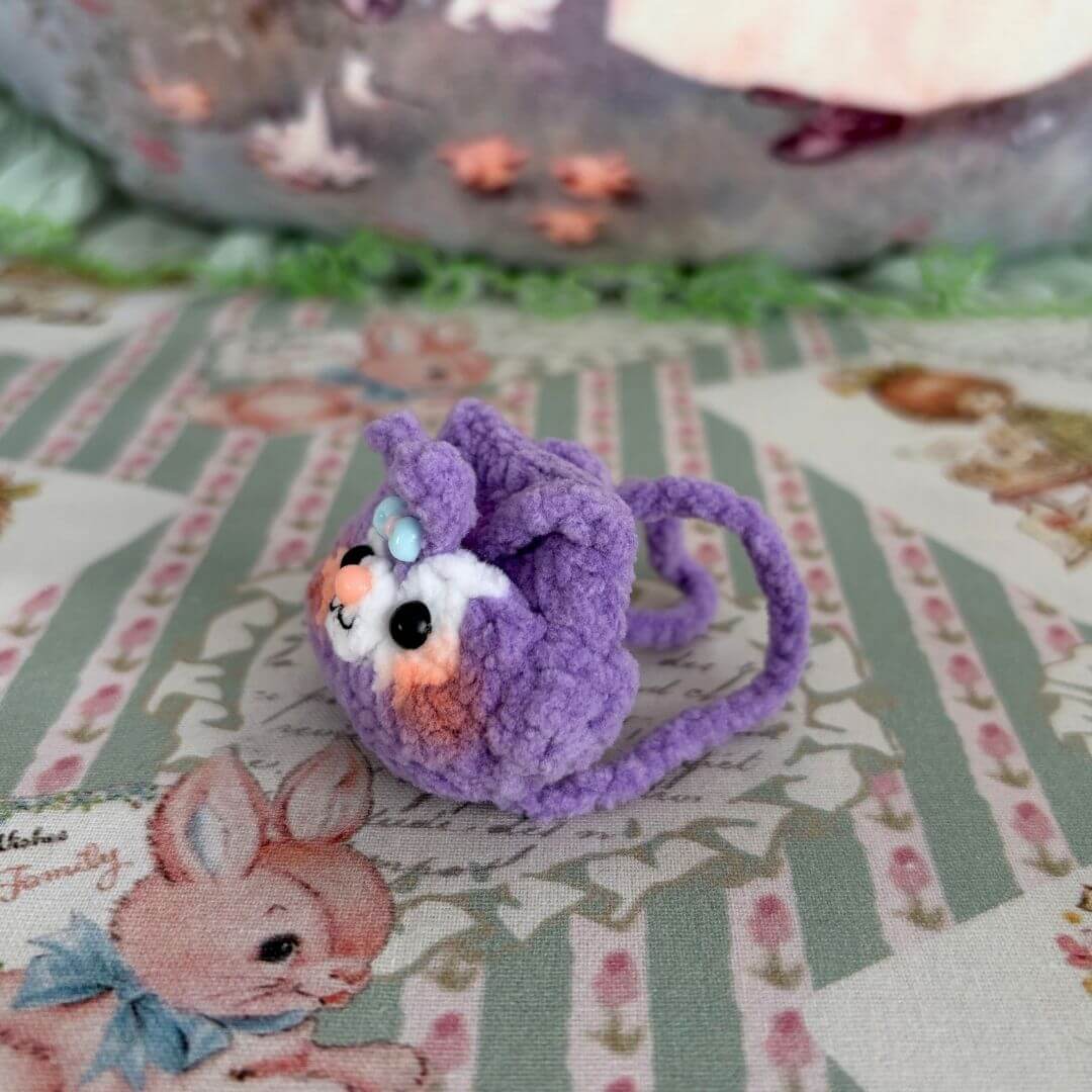 Handmade Mini Backpack featuring a cute purple fluffy kitten figurine with a sweet expression and decorative bow, perfect for collectibles.