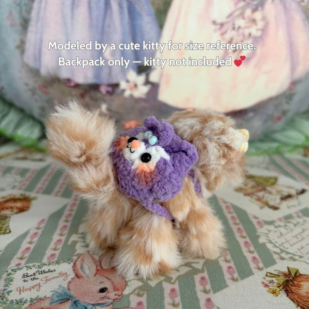 Handmade Mini Backpack on a fluffy kitten figurine in a purple outfit, showcasing cute details and soft textures for a collectible look.