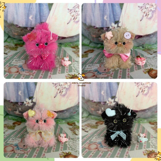 Twinkling Kitten Collection featuring four handmade kittens in pink, beige, and black with bows and glittering accents.