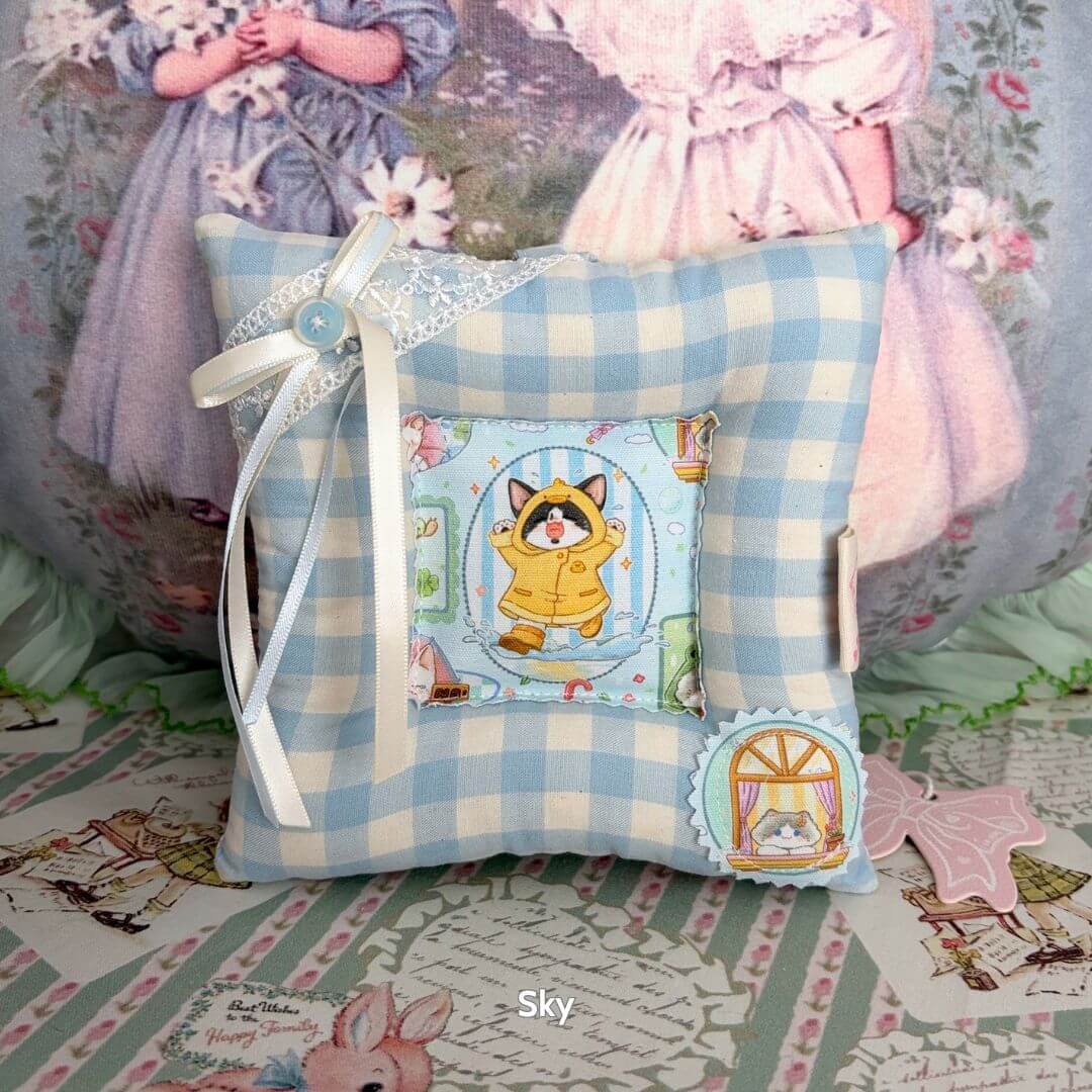 Kitten Coasters – For Cups and Kitten Display featuring a blue gingham cushion with a cute kitten print and decorative ribbon.
