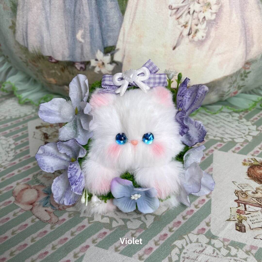 Blossom Kitten Collection: adorable fluffy kitten figurine in pastel colors, surrounded by purple flowers, with a cute bow accent.