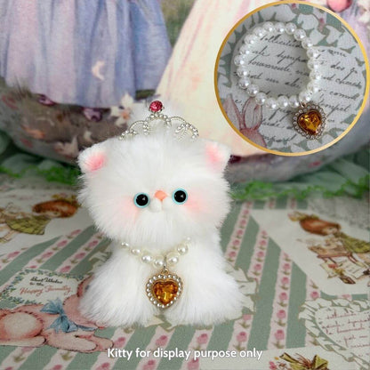 Fluffy kitten figurine wearing an Elegant Heart Necklace, featuring a heart-shaped pendant and pearl accents, perfect for display.