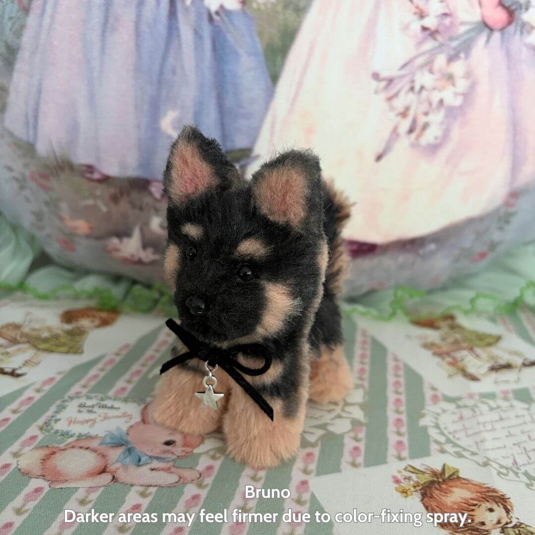 Lifelike Puppy Collection featuring a handmade black and tan plush puppy with a bow, set against a patterned background.