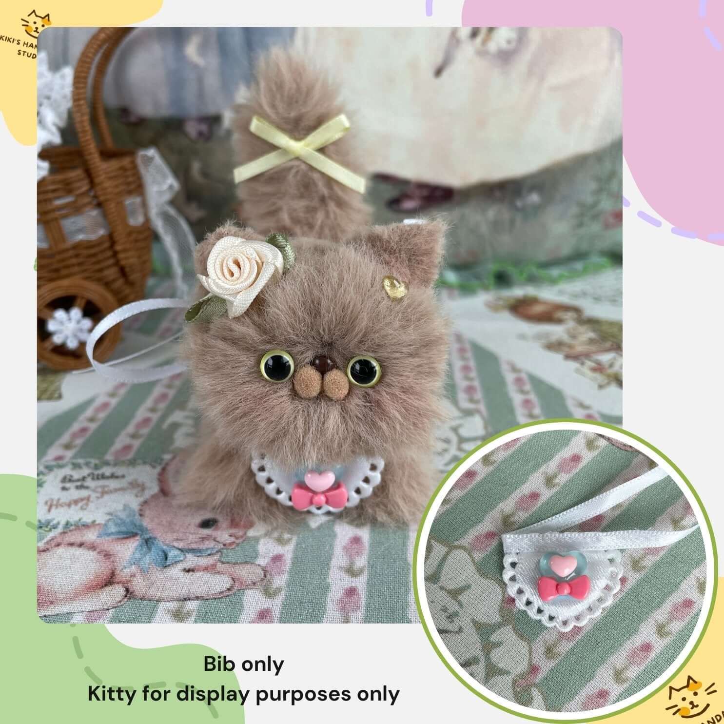 Handmade mini bib on plush kitten for illustration; purchase includes bib only, not plush kitten.