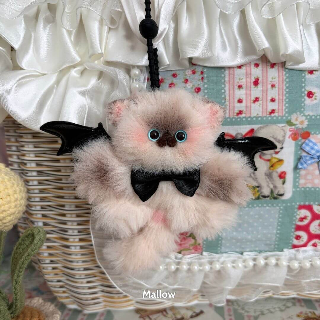 Handmade Winged Kitty Pendant featuring a fluffy beige kitten with black wings and a bow tie, perfect for cat lovers and collectors.