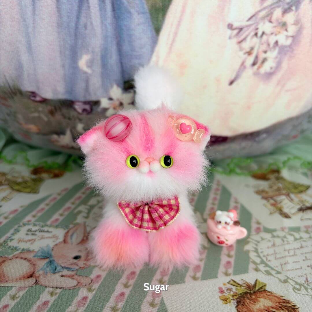 Sweet Dreams Kitten Collection - cute pink fluffy kitten figurine with a bow tie and accessories, a fantasy-themed collectible cat.