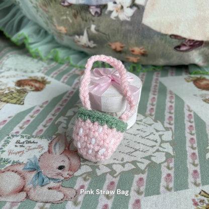 Handmade pink straw bag accessory for plush toys, surrounded by cute animal-themed decor. Perfect for styling plush kittens and puppies.