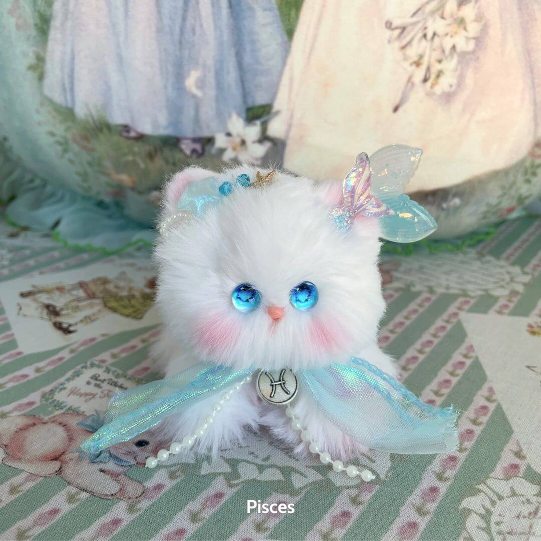 Handmade kitten from Zodiac Kitten Collection, fluffy white mini cat figurine with blue eyes, adorned with ribbons and butterfly accessory.