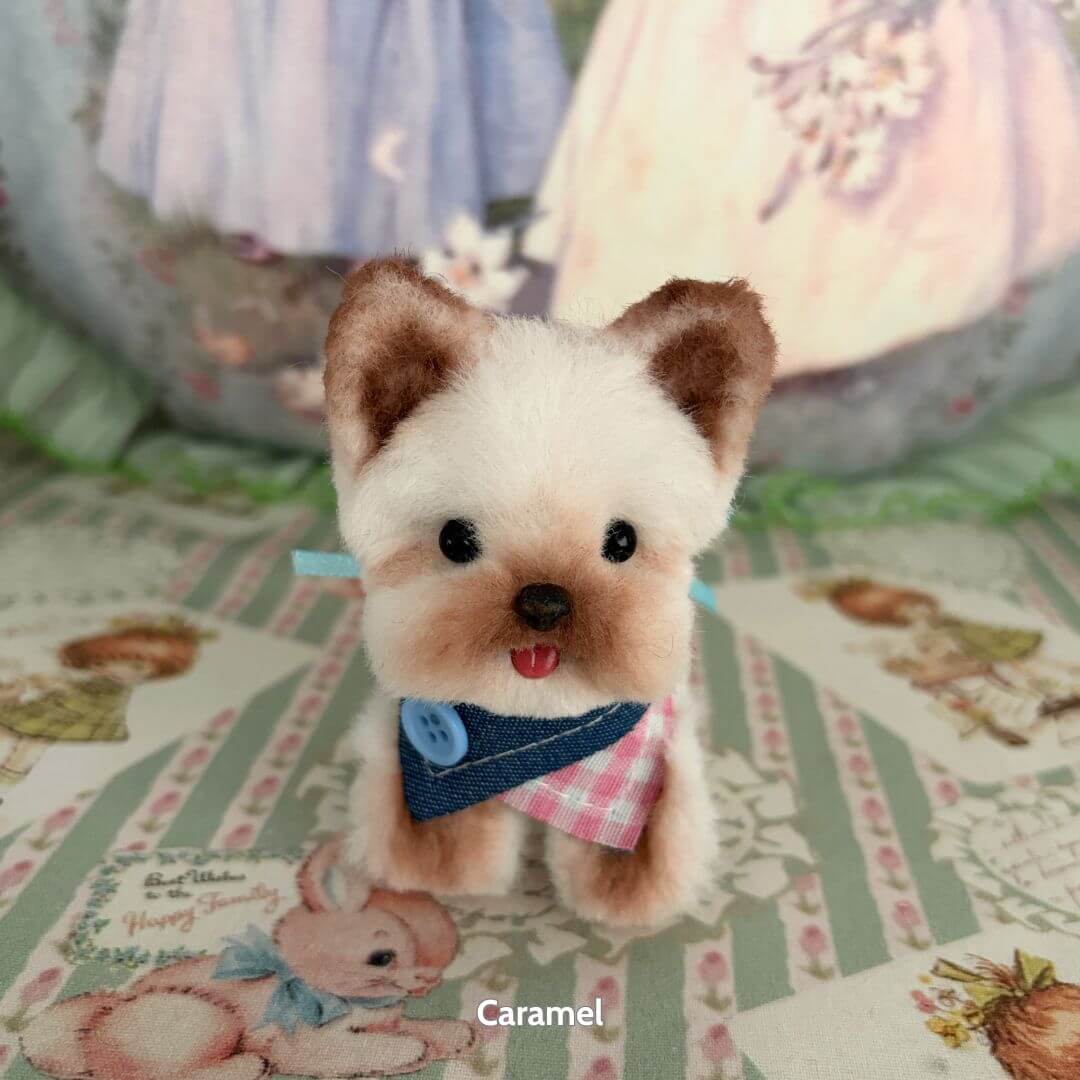 Lifelike Puppy Collection miniature fluffy dog figurine in a blue and pink bandana, featuring cute details and soft textures.