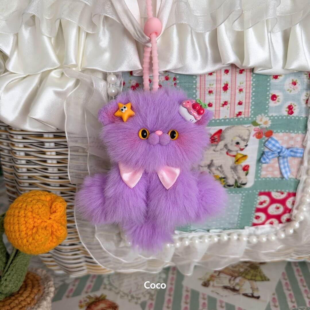 Adorable Kitten Pendants featuring a fluffy purple kitten with accessories, handcrafted and cute, perfect as a whimsical bag charm.