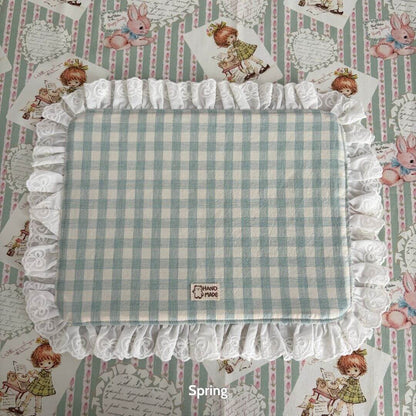 Handmade Sweet Tea Mat with mint green checks and lace trim, perfect for adding charm to tea time in a cozy setting.