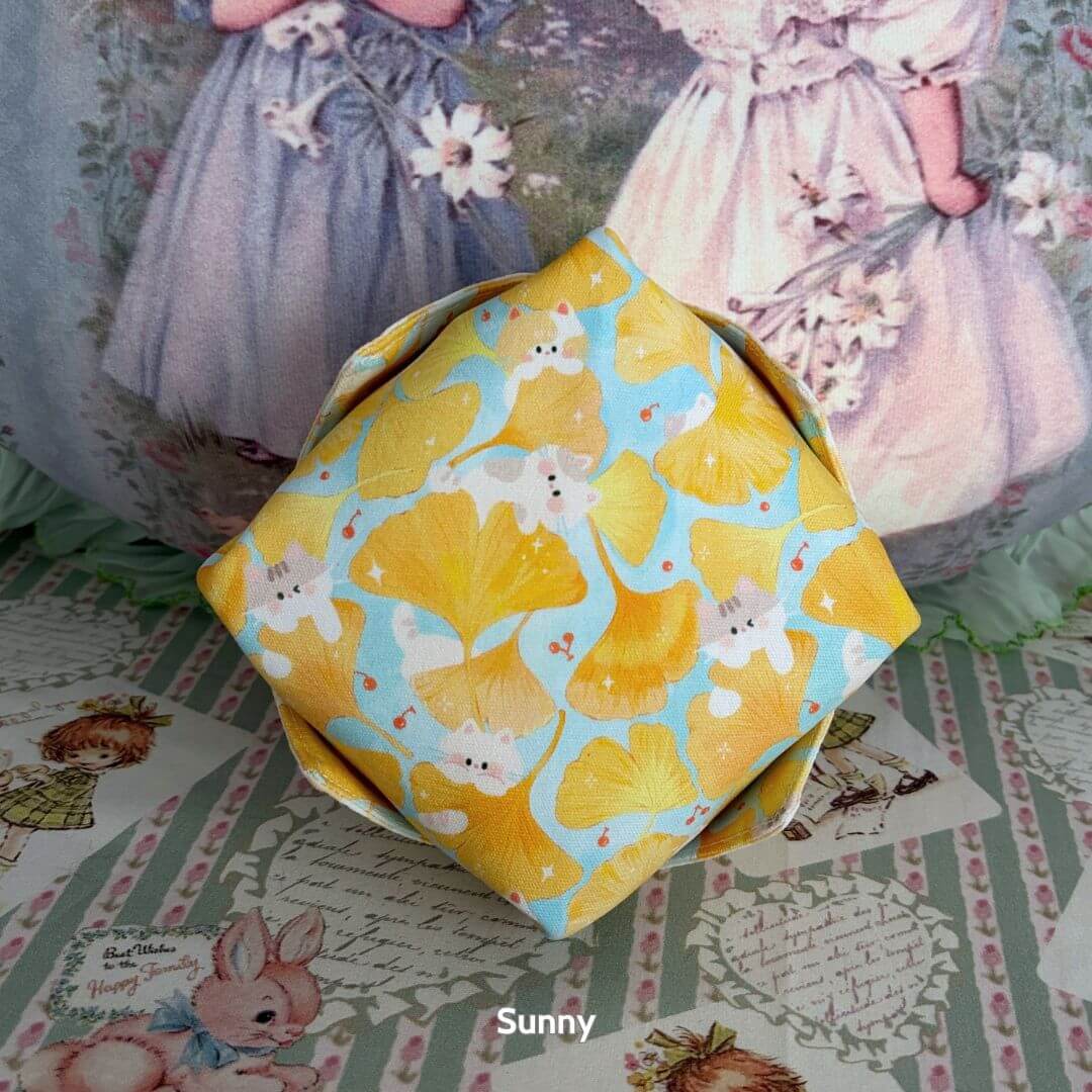 Gingham Cat Catch-All Tray featuring pastel yellow floral patterns and kittens, a cute collectible decor piece for any space.
