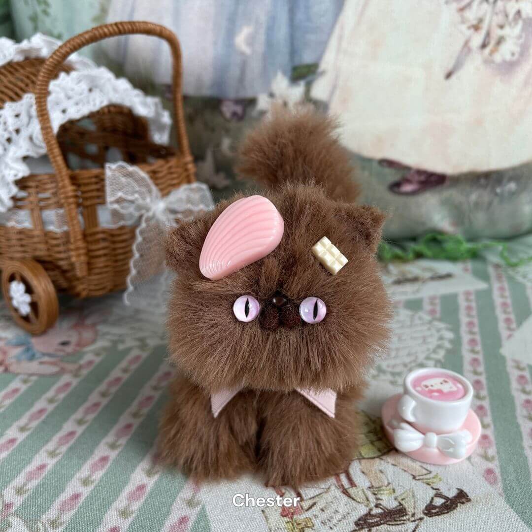 Handmade brown kitten plush toy with waffle clip and teacup accessory, part of the Brown Kitten Collection, styled for decor.