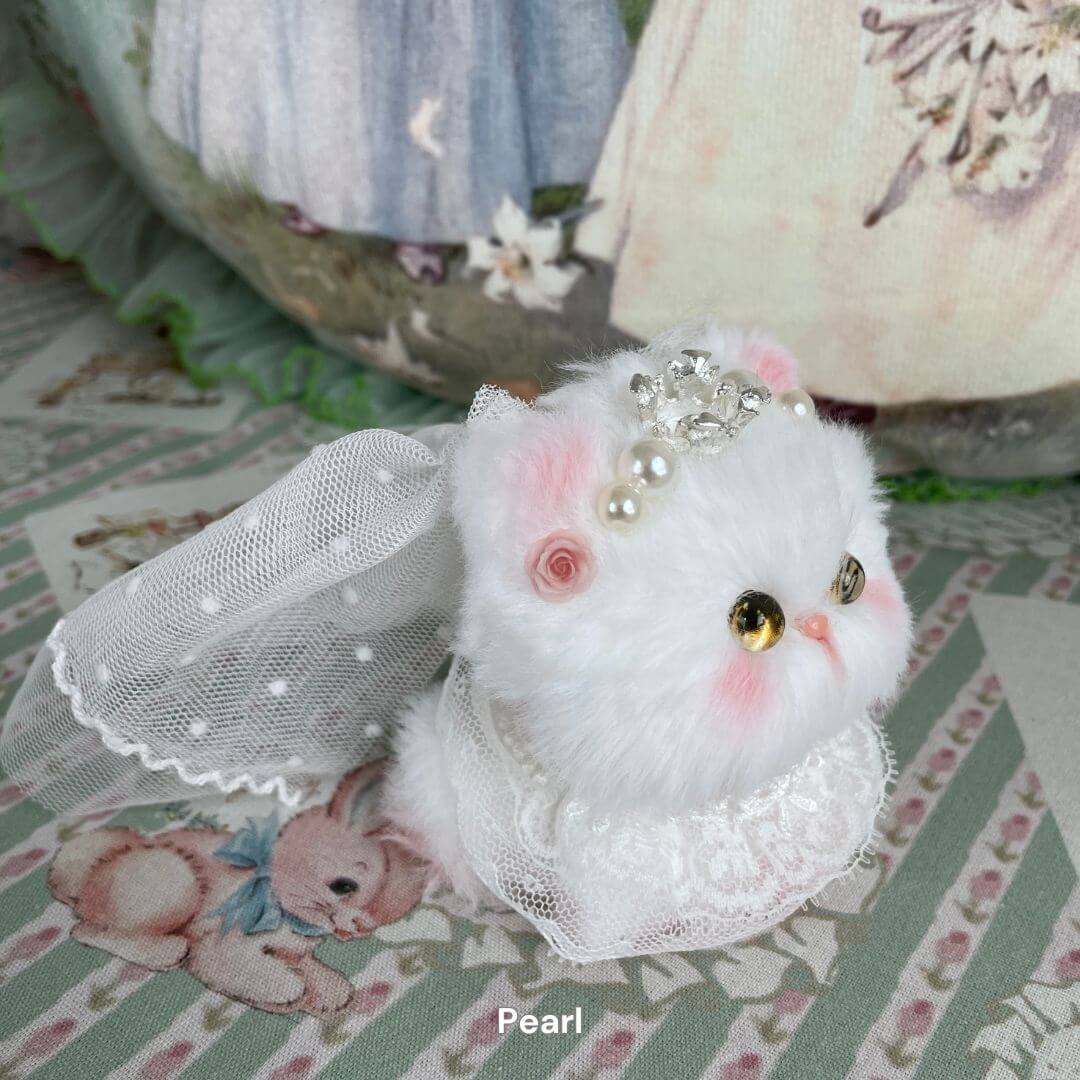 Handmade plush white kitten with pearl crown and veil from Fairy Paws Collection, featuring soft faux fur and enchanting accessories.