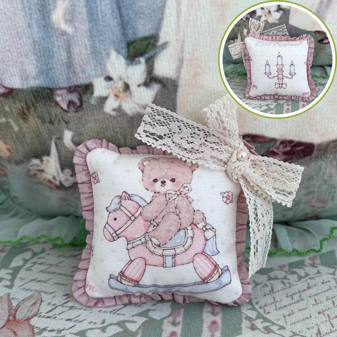 Handmade mini cuddle critter cushion with teddy bear design and hand-stitched bow, perfect toy or desk decoration.