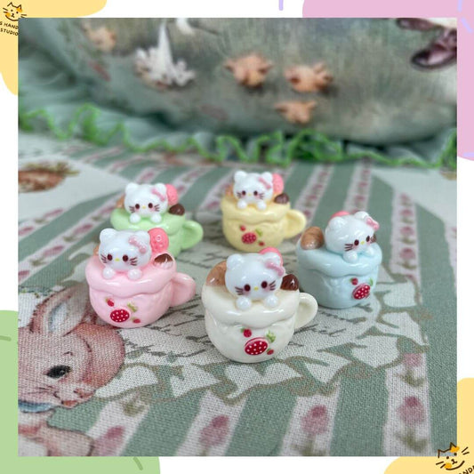 Set of 5 Cuppa Kitties plush toys in colorful dessert cups, handmade and collectible, perfect for decoration or accessories.