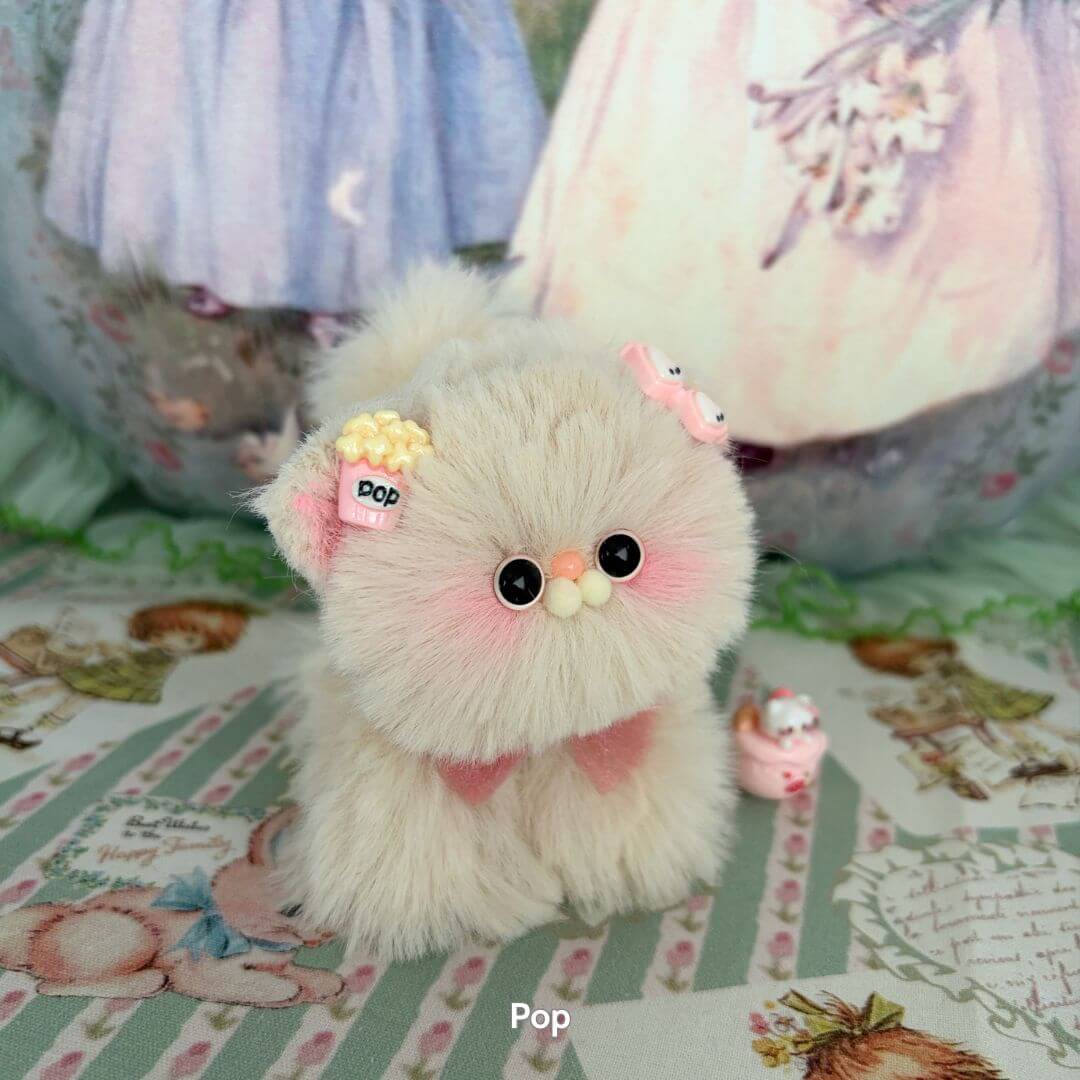Adorable fluffy kitten figurine from the Fluffy Kitten Collection, featuring pastel colors and cute accessories.