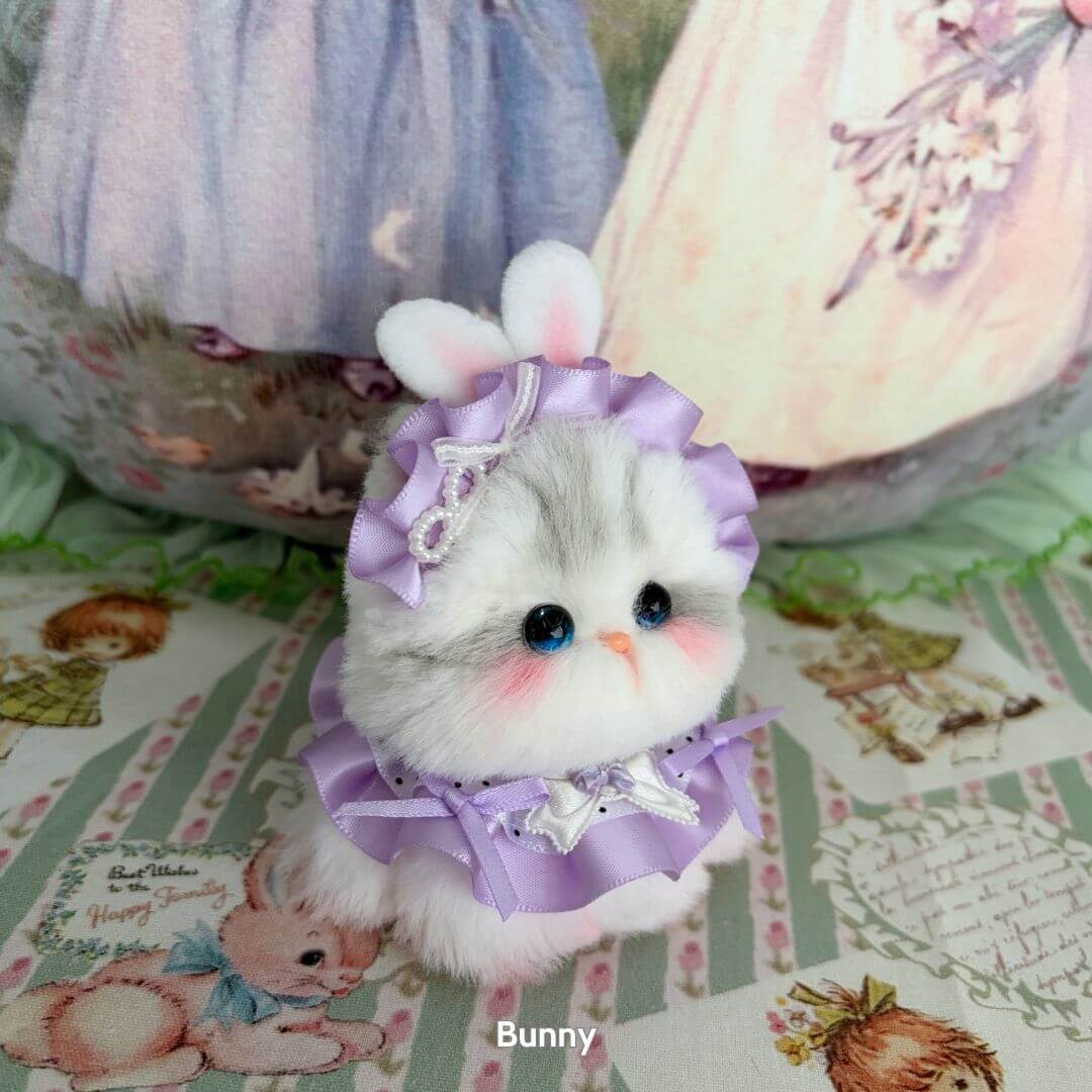 Cosplay Kitten Collection: adorable fluffy kitten figurine in lavender frock with ribbons and bunny ears, handcrafted in UK.