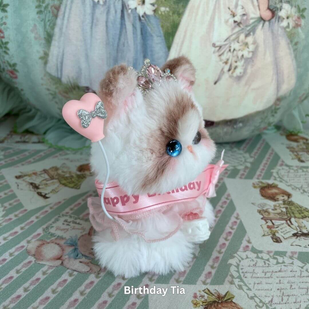 Handmade plush kitten toy with tiara and birthday sash, part of the Enchanted Big Paws Collection by Kiki's Handmade Studio.