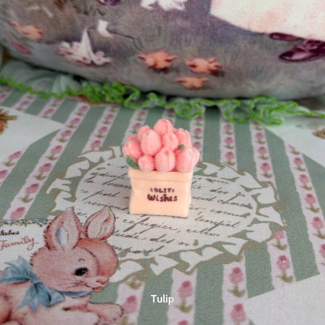Mini Flower Bag featuring a handmade kitten figurine surrounded by fluffy pink tulip decorations on a pastel fabric backdrop.