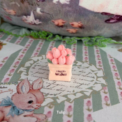 Mini Flower Bag featuring a handmade kitten figurine surrounded by fluffy pink tulip decorations on a pastel fabric backdrop.