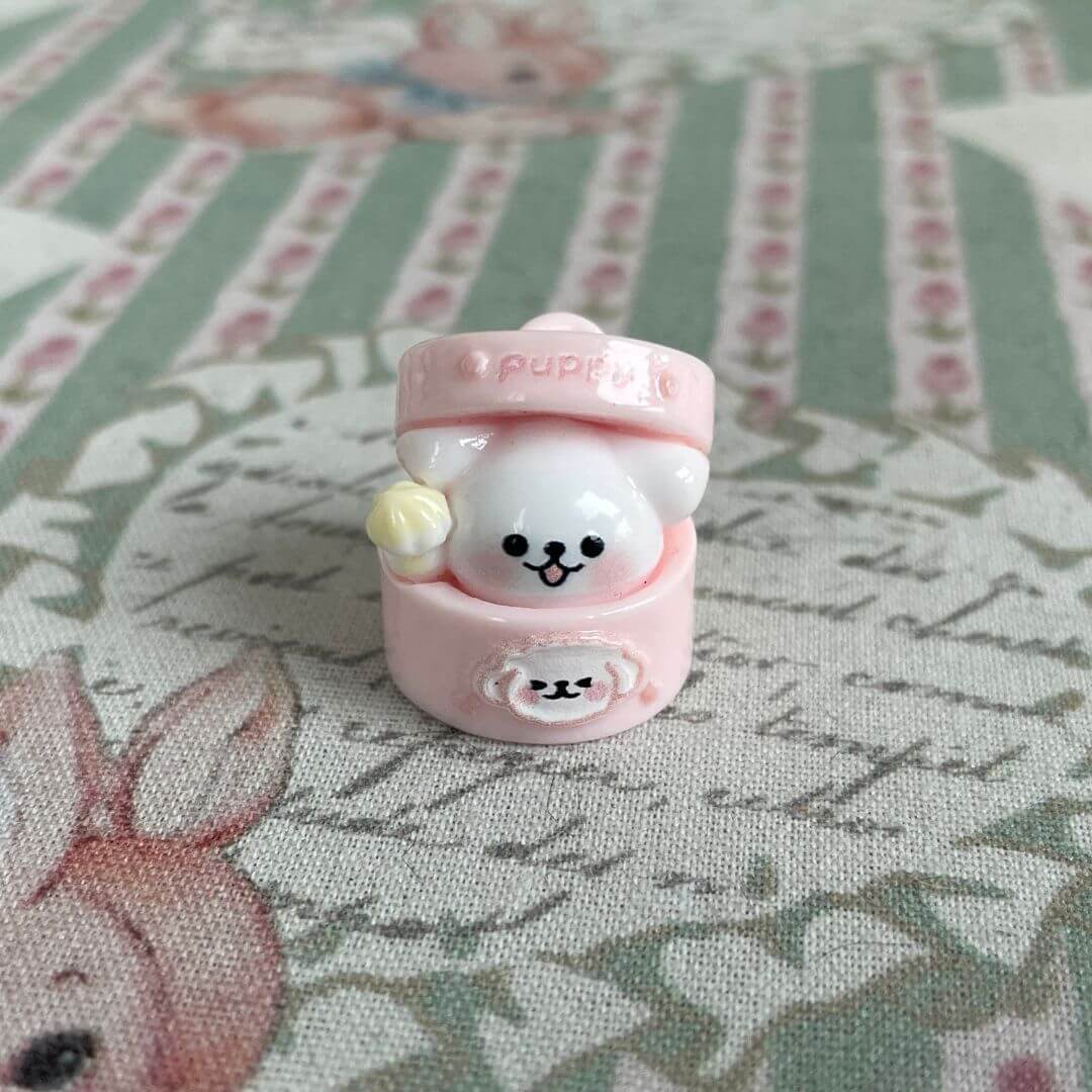 Miniature puppy-themed pod decoration with cute design, perfect for dollhouse or desk display, adding charm and whimsy to decor.