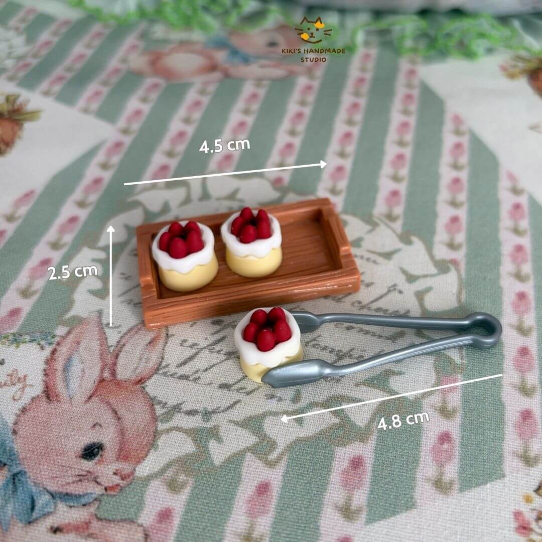 Mini Strawberry Cake Set featuring tiny cakes with strawberries on a wooden tray and miniature serving tongs, perfect for dollhouse decor.