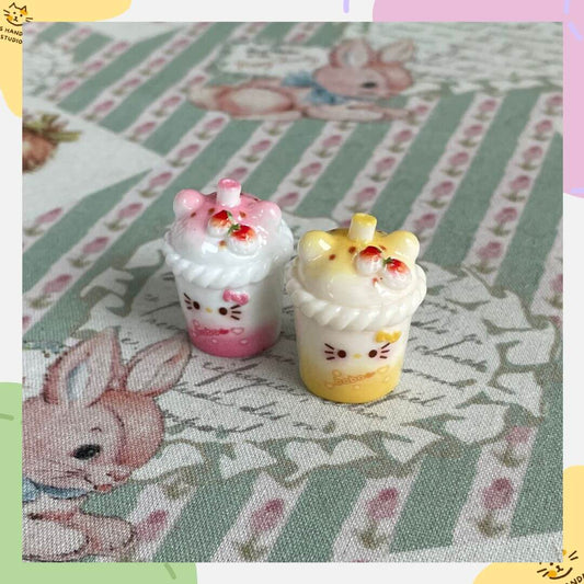 Mini cat-themed milkshake decorations for dollhouse decor, featuring pink and yellow designs, ideal for cat lovers and collectors.