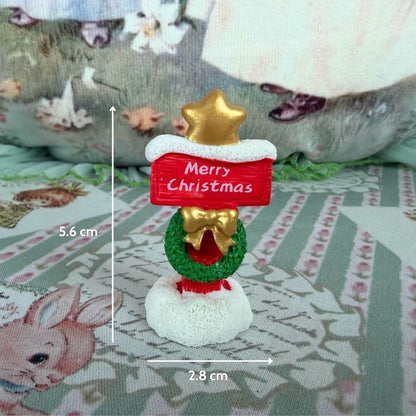 Miniature Christmas Accessories featuring a handmade festive sign with a star and wreath, perfect for dollhouses.