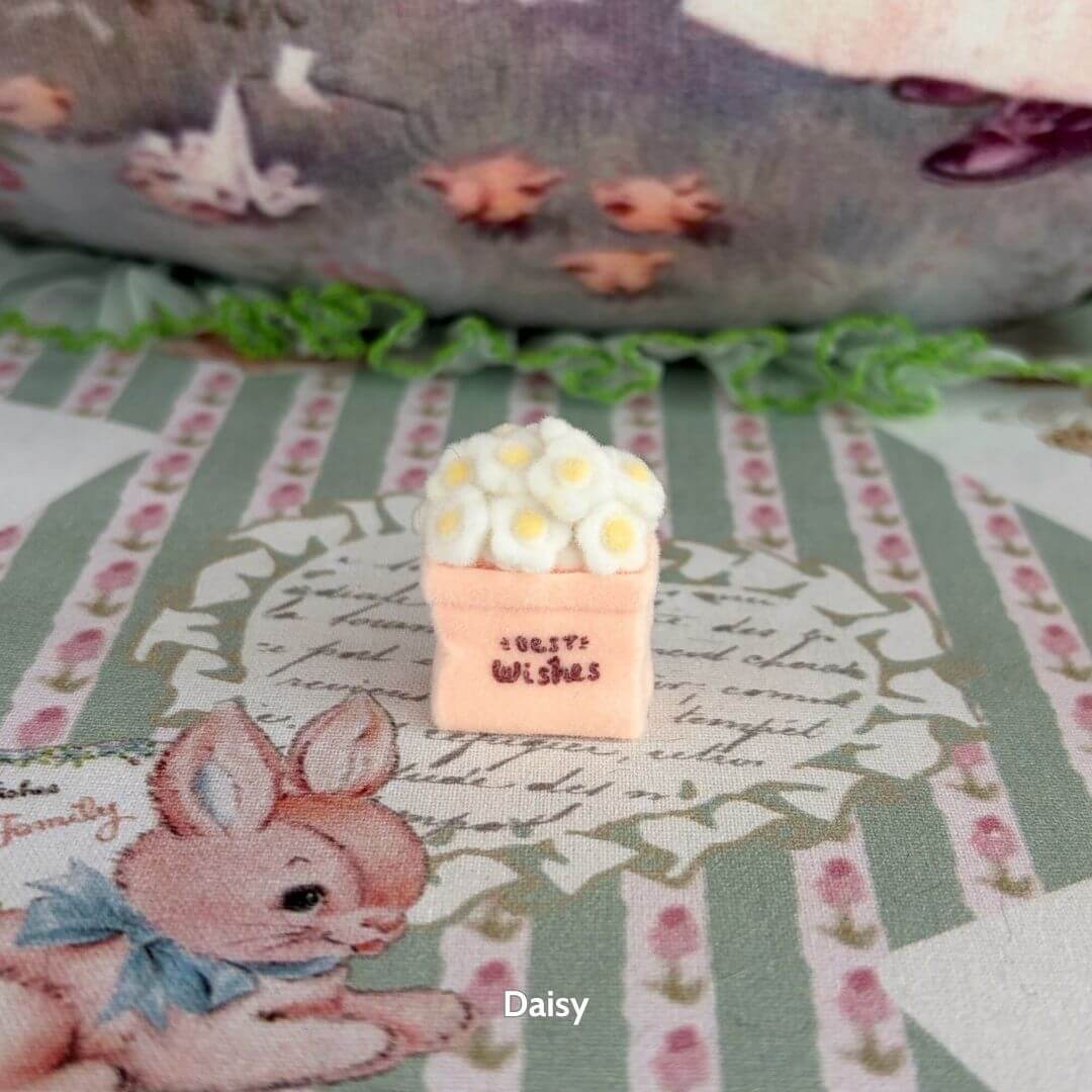 Mini Flower Bag featuring a handmade kitten figurine next to a pink decorative box with fluffy white flowers, colorful and kawaii decor.
