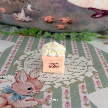 Mini Flower Bag featuring a handmade kitten figurine next to a pink decorative box with fluffy white flowers, colorful and kawaii decor.