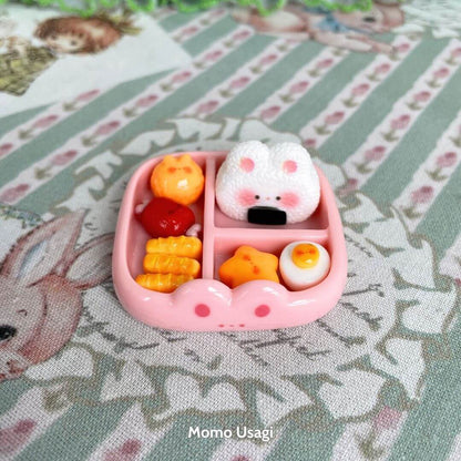 Mini Cat Bento Box featuring a cute fluffy kitten-shaped onigiri and miniature food items in a pink tray, handmade collectible decor.