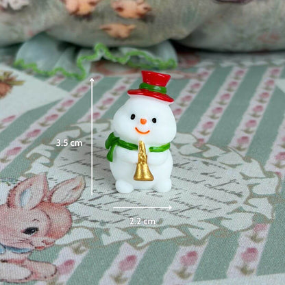 Miniature Christmas Accessories featuring a cute snowman figurine with a red hat and green scarf, perfect for festive decor.
